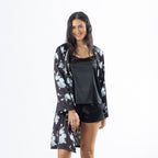 Eden Malibu Satin Printed Robe in Black worn open over a coordinating black satin sleepwear set.