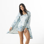 Eden Malibu Satin Printed Robe in Pale Blue worn open over a coordinating floral camisole and shorts set.