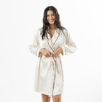 Eden Malibu Satin Robe in Ivory featuring a smooth satin finish, black contrast piping and matching waist tie.