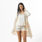 Eden Malibu Satin Robe in Ivory worn open over a coordinating ivory satin camisole and shorts set.