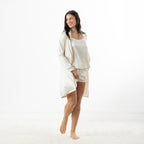 Eden Malibu Satin Robe in Ivory worn open over a coordinating ivory satin camisole and shorts set.
