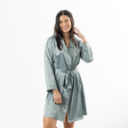 Eden Malibu Satin Printed Robe in Sage featuring a small repeating green floral motif and matching waist tie.