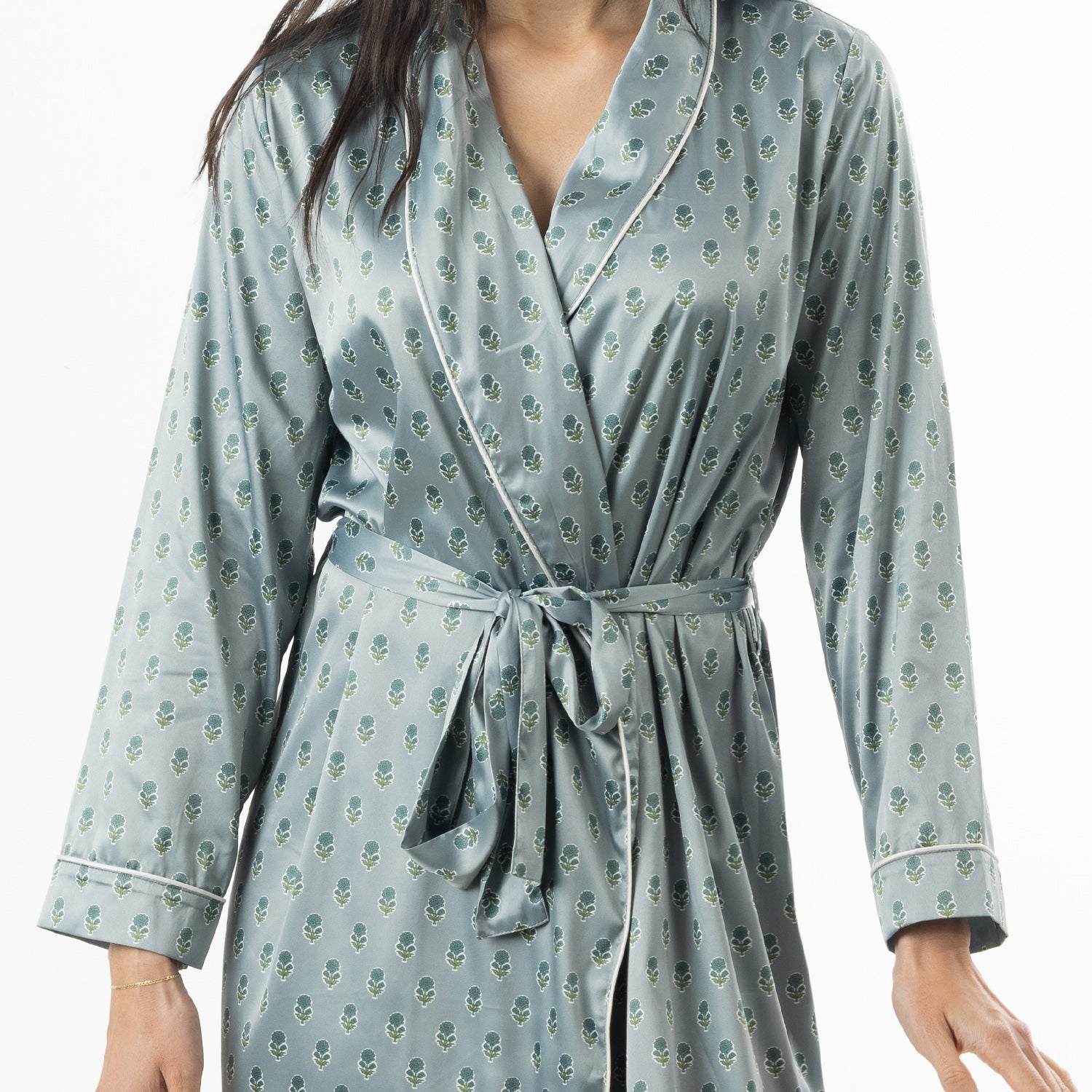 Close-up of the Eden Malibu Satin Printed Robe in Sage, highlighting the small floral print, satin finish, piping and waist tie.