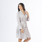 Amparo Cassie Satin Print Bathrobe in Pink shown from a slight side angle, featuring the wrap-style front, flowing knee-length hem and adjustable waist tie.