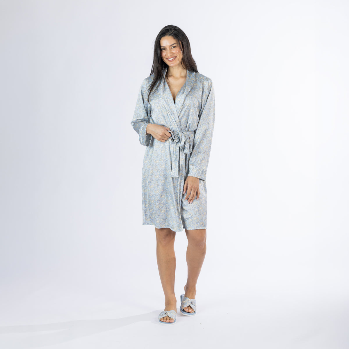 Full-length view of the Amparo Cassie Satin Print Bathrobe in Denim, showing the knee-length silhouette, relaxed fit, adjustable waist tie and coordinating printed slippers.