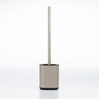 A modern toilet brush with a matte taupe-cylindrical base and a matching long handle, standing upright on a clean white background.