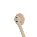 A close-up of a taupe suction piece shown against a solid white background.