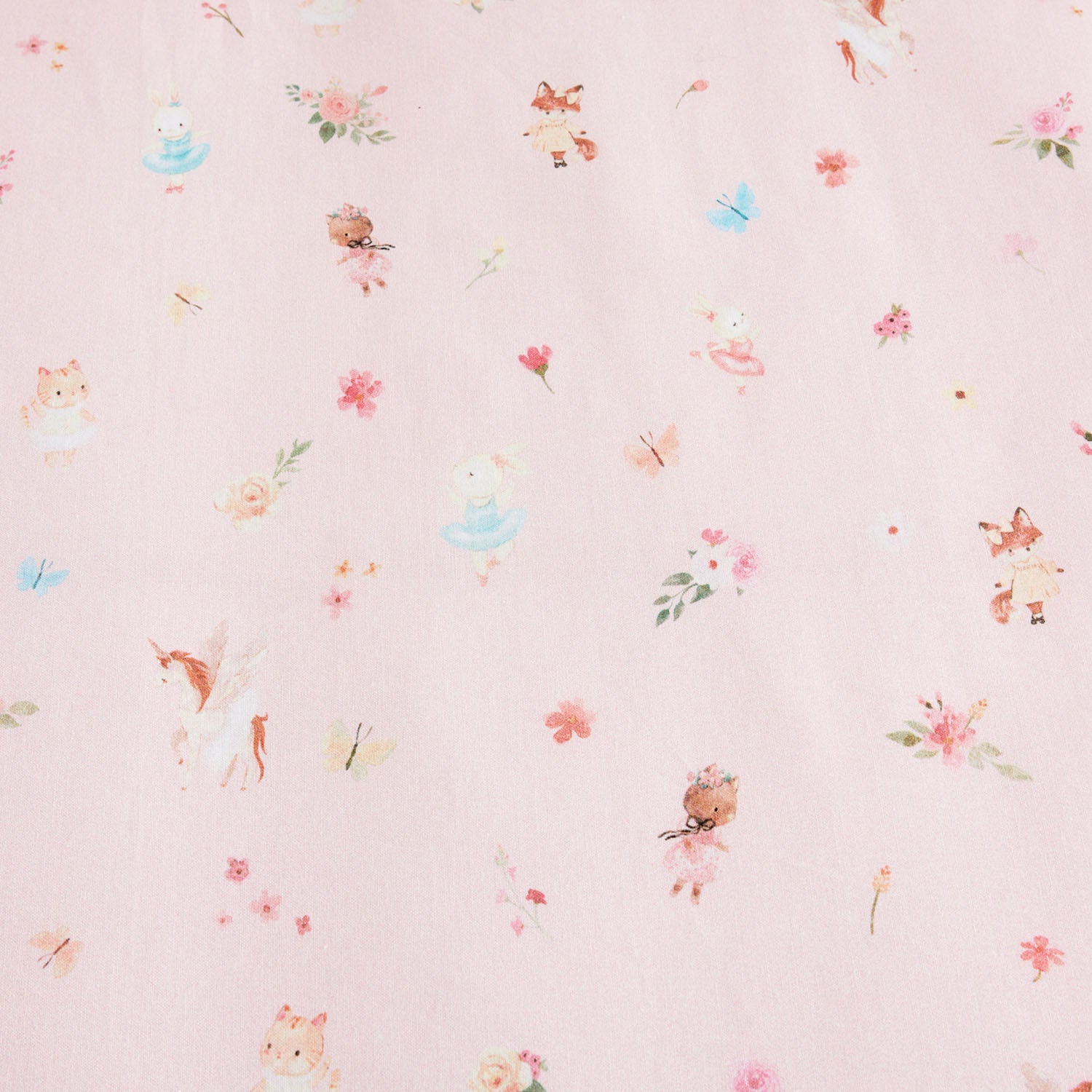 Pale pink kids floral print fabric with small scattered flowers and leaves.