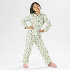 Child wearing bb&b Sleep Kids Dog flannelette pyjama set with a playful all-over print.