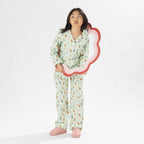Child wearing bb&b Sleep Kids Dog flannelette pyjama set with a playful all-over print.