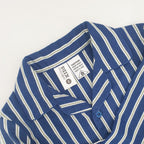 Blue striped flannelette pyjama shirt close-up showing the collar and button detail.