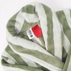  green striped robe up close showing the tag and warning label 