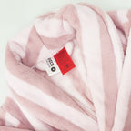 pink striped robe up close showing the tag and warning label 