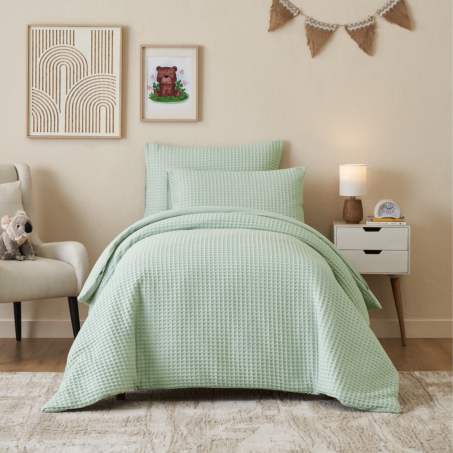 Light mint duvet cover set styled on a bed in a neutral bedroom.