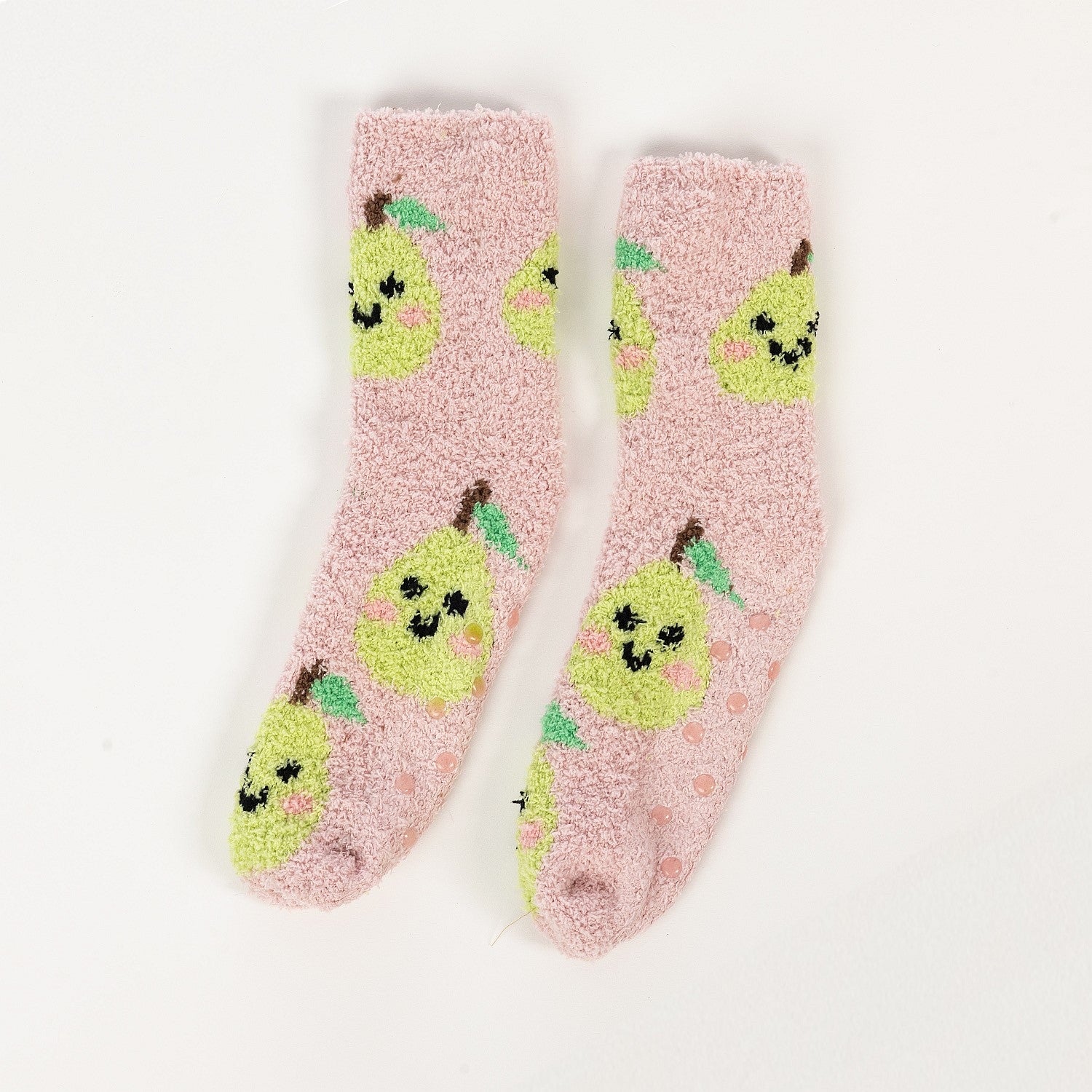 Pink kids bed socks with green pear design, with a white background 