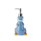 bb&b Kids Dino Soap Dispenser in Blue, featuring a playful dinosaur-shaped ceramic design with a silver pump and colourful orange and yellow feet.