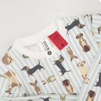 Child wearing bb&b Sleep Kids Dog Stripe knit pyjama twosie up close showing the tags.