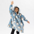 Child wearing a blue hedgehog print oversized hoodie with a cosy hood and front pocket.