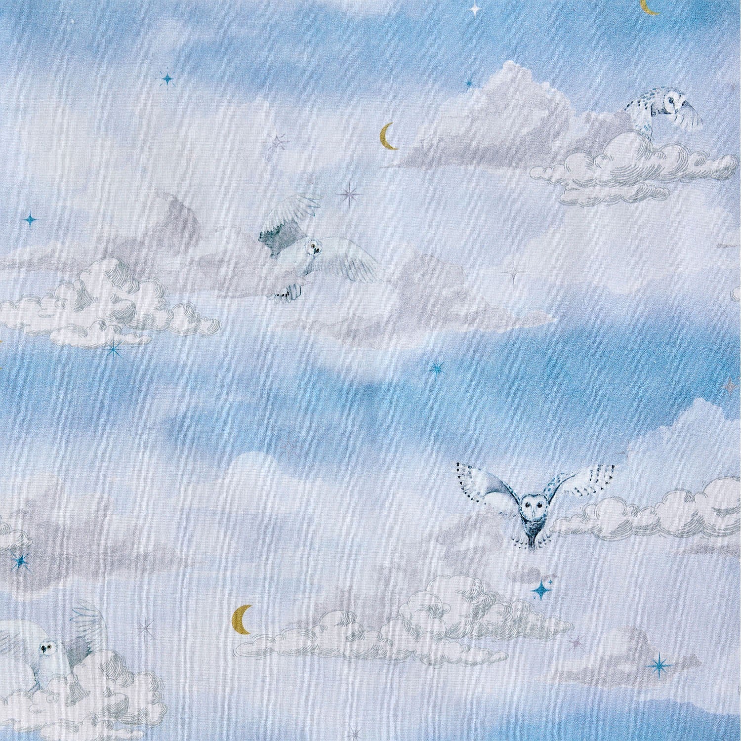 Blue kids cloud print fabric with moons and stars.