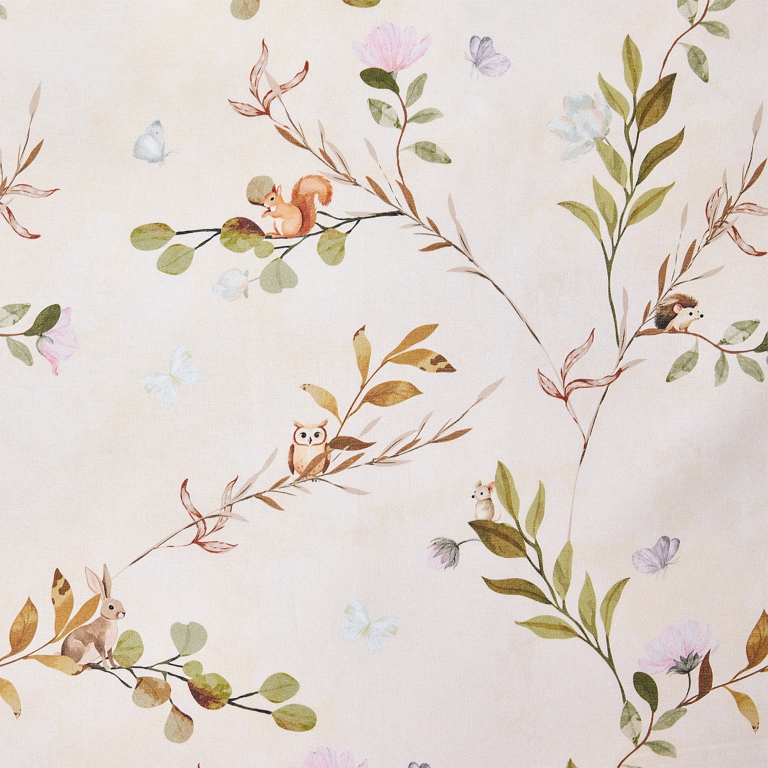 Baby cot styled with natural colour fabric with a delicate leafy vine print in soft green and brown tones. 