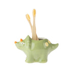 bb&b Kids Dino Toothbrush Holder in Green shown holding two bamboo toothbrushes.