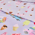 Close-up of the bb&b Kids Ice Cream Shop duvet cover set showing the lilac bedding print with colourful ice cream cones, popsicles, trucks and sweet treat motifs.