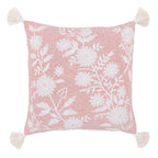 A soft blush cushion featuring an elegant white floral print and decorative tassel corners adds a fresh, charming touch to any living space.
