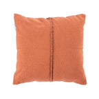 A warm rust cushion featuring a soft woven texture and a central braided trim adds rich colour and understated style to any living space.