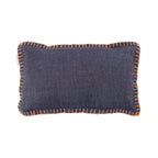A charcoal breakfast cushion featuring contrasting terracotta blanket-stitch edging adds a warm, contemporary accent with simple, understated style.