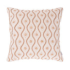 A soft cushion featuring an embroidered geometric floral pattern with wavy stitched detailing adds warmth, texture, and a charming decorative touch to any living space.