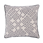 A cream cushion featuring a navy embroidered geometric pattern with contrasting piped edging adds modern texture and timeless style to any living space.