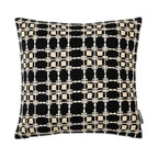 A black cushion featuring a cream embroidered windowpane grid pattern adds bold contrast, rich texture, and contemporary style to any living space.