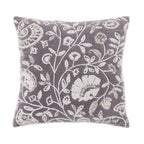 A soft charcoal cushion featuring an intricate ivory embroidered botanical pattern adds elegant texture, timeless charm, and a sophisticated touch to any living space.