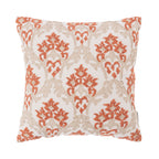 A cream cushion featuring an embroidered red and natural damask pattern adds warm colour, rich texture, and timeless elegance to any living space.