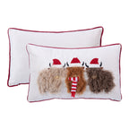White Christmas cushion featuring three fluffy Highland cows wearing Santa hats, with red piping and a plain white reverse.