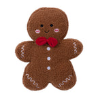 Front view of the gingerbread man cushion, featuring a smiling embroidered face, red bow tie, white buttons and icing details.