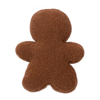 Back view of the gingerbread man cushion, showcasing its plain brown textured fabric.