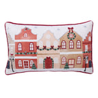 Front view of the Christmas Town Cushion featuring colourful townhouses decorated with Christmas wreaths, garlands and festive trees.