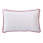 Back view of the plain white Christmas Town Cushion with contrasting red piping against a white background.