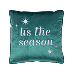Front view of the green velvet 'Tis the Season Cushion featuring white embroidered lettering and decorative stars against a white background.