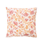 A square decorative cushion featuring a vintage-style floral pattern in orange and dusty pink on an off-white background, isolated on a white studio background.