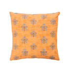 A rich mustard ground cushion with a repeating floral motif in soft grey and neutral tones.