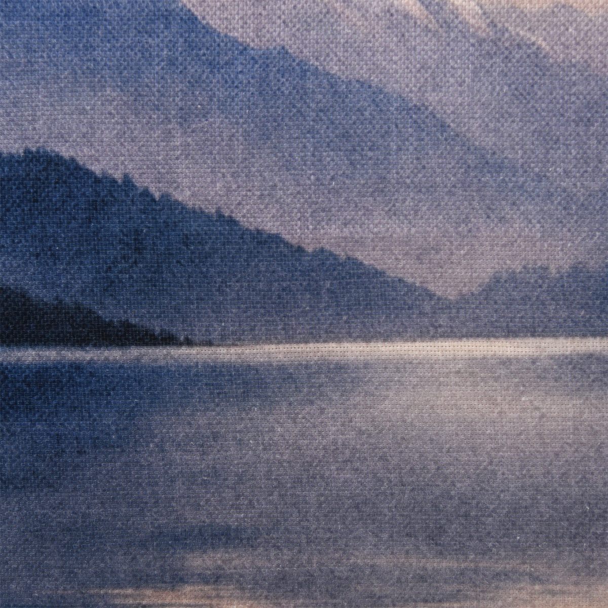 Close-up of the Fieldcrest Fiordland at Dusk Cushion showing the woven fabric texture and layered blue mountain and lake design.
