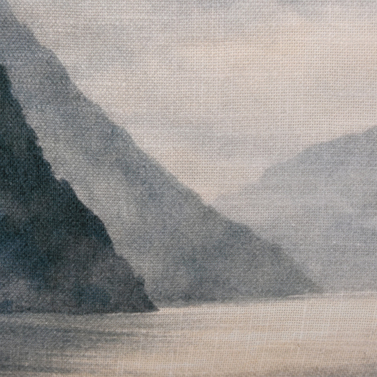 Close-up of the Fieldcrest Misty Milford Sound Cushion showing the woven fabric texture and layered dark mountain landscape.