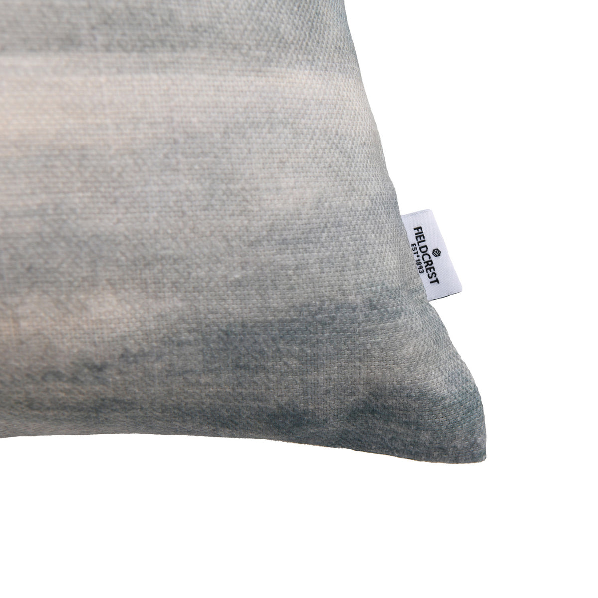 Close-up of the Fieldcrest Misty Milford Sound Cushion corner showing the textured fabric, muted mountain design and Fieldcrest brand label.