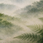 Close-up of the Fieldcrest Northland Forest Cushion showing the woven fabric texture, misty forest scenery and layered green fern details.