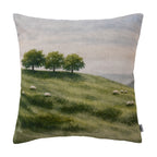 Fieldcrest Whanganui Grazing Cushion featuring rolling green hills with grazing sheep, scattered trees and a soft misty landscape in natural green tones.