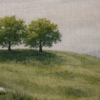 Close-up of the Fieldcrest Whanganui Grazing Cushion showing the woven fabric texture, rolling green hills and tree details.
