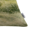 Close-up of the Fieldcrest Whanganui Grazing Cushion corner showing the textured fabric, green landscape print and Fieldcrest brand label.