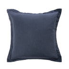 A square throw pillow in a textured midnight blue fabric with a matching piped border, shown against a plain white background.